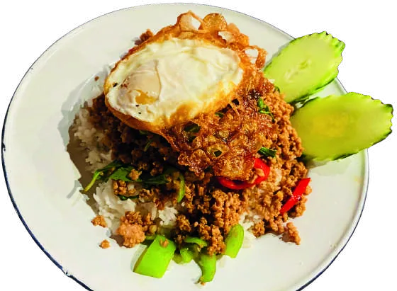 Holy basil stir-fry over rice with a fried egg